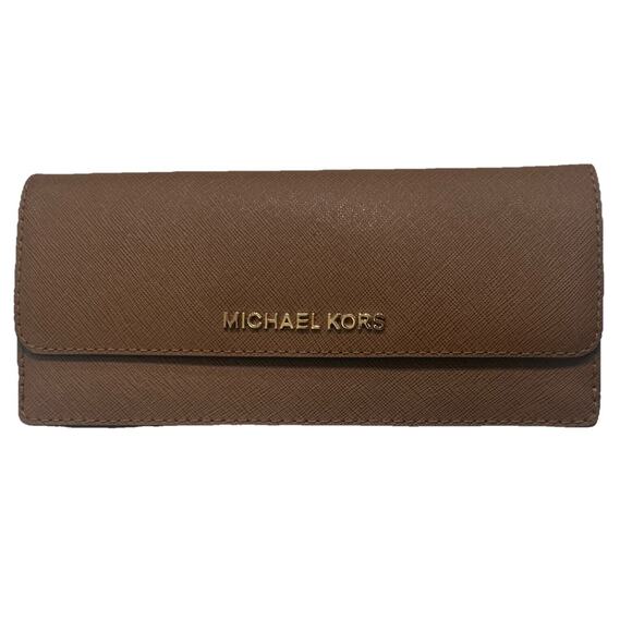 Michael Kors Handbags - Michael Kors slim bifold wallet 7.5”X3.5” Mint condition